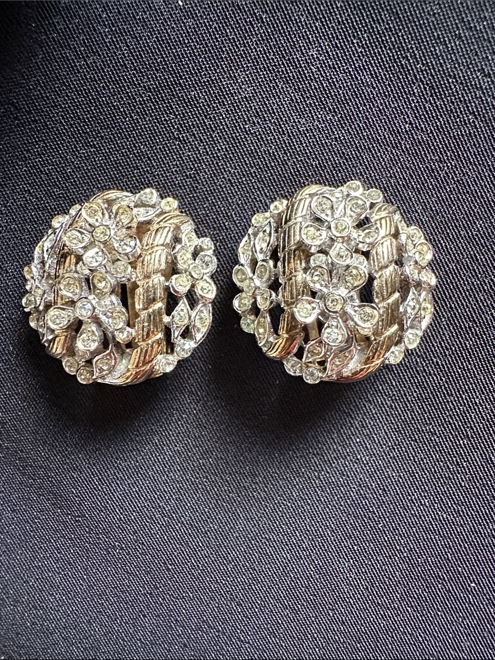 Vintage Crown Trifari EUC clip on earrings. Two tone metal & floral rhinestones